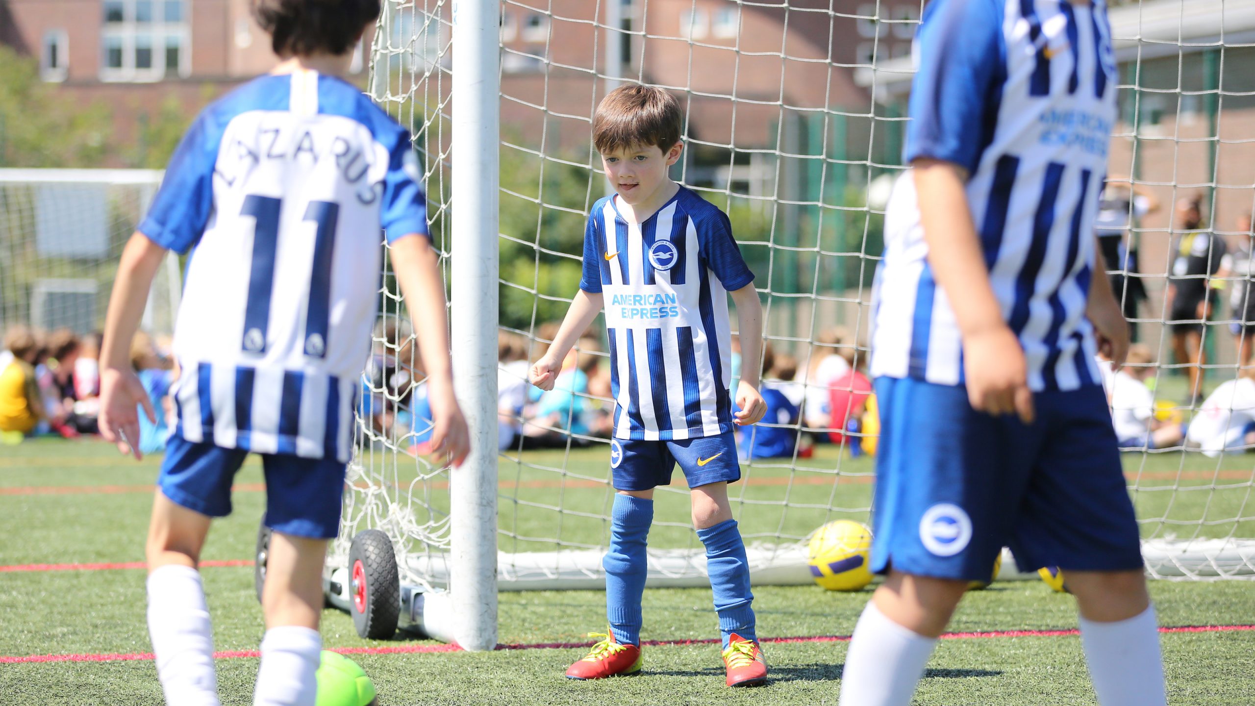 young kids playing football