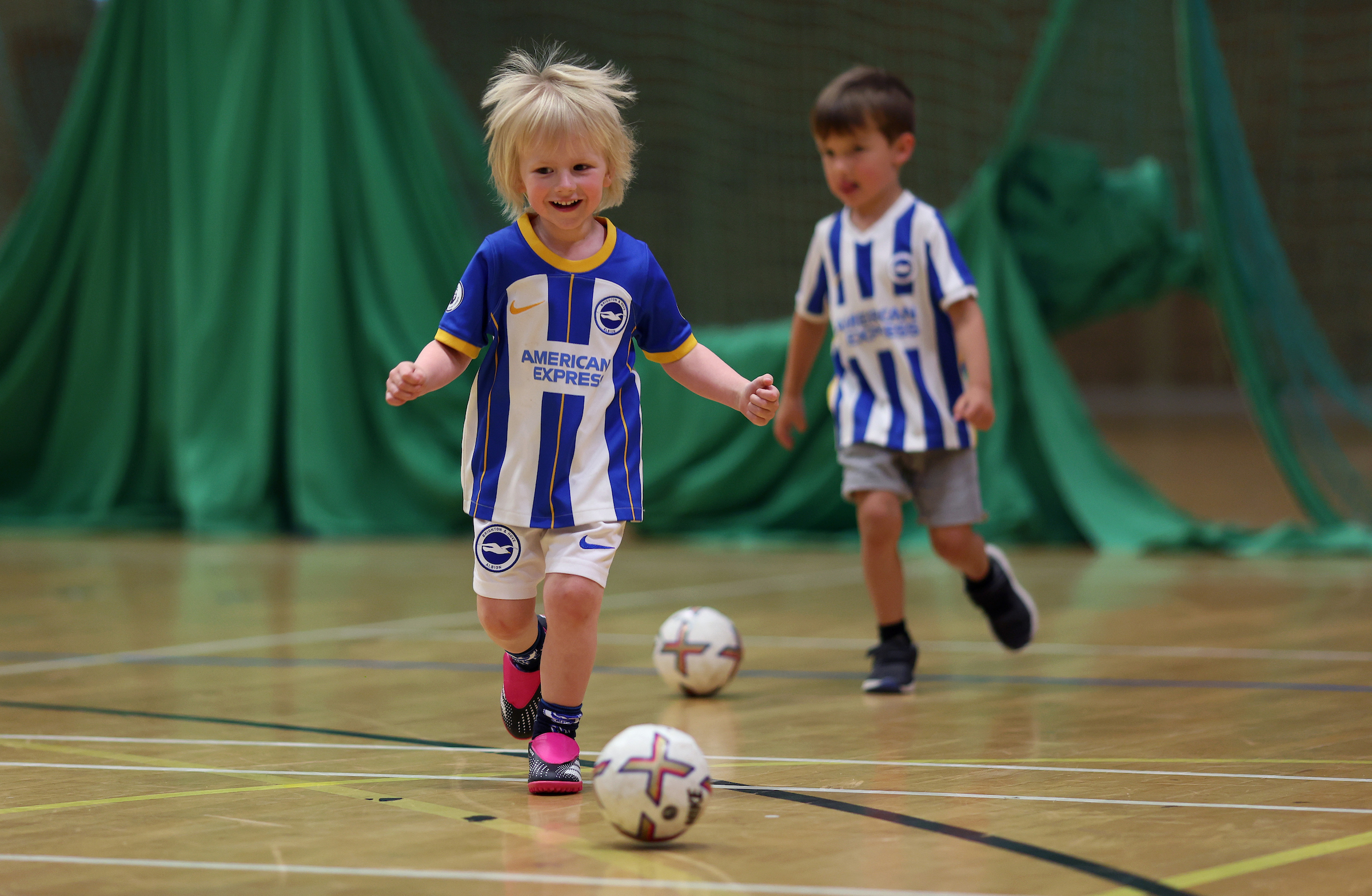 children having fun playing football
